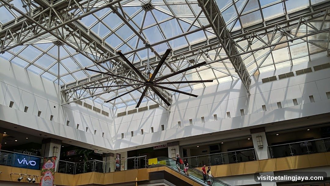 Shopping Mall Interior with Skylight and Hanging Fan