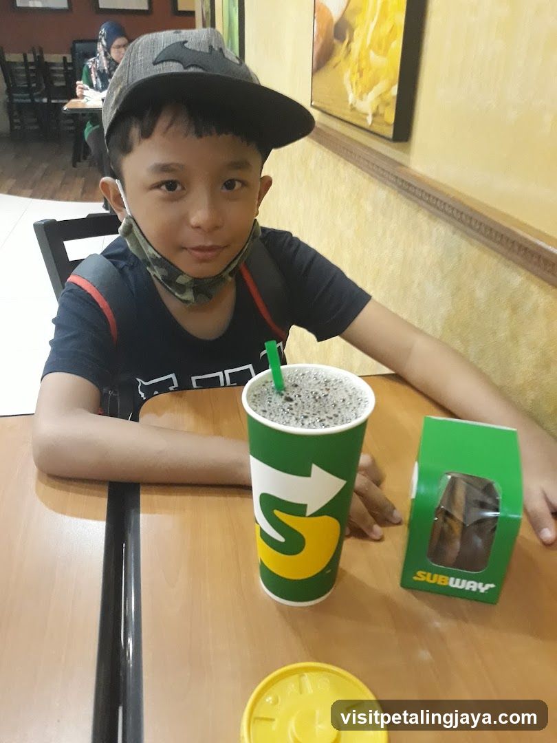Boy with Subway Drink and Sandwich