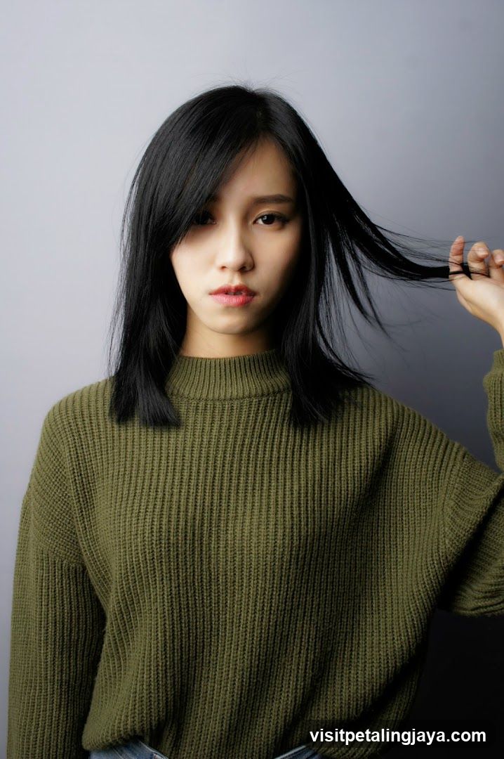 Portrait of a woman in olive sweater