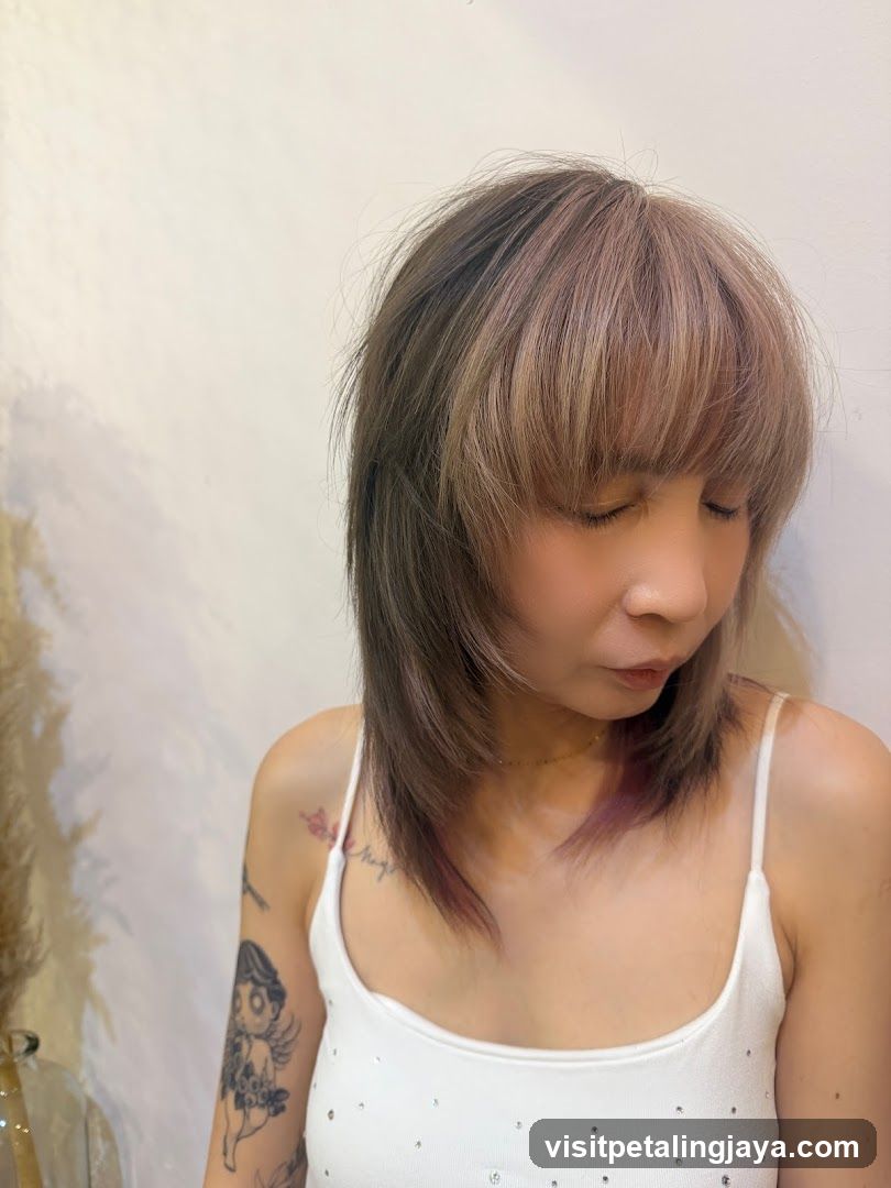 Woman with short hair and tattoos