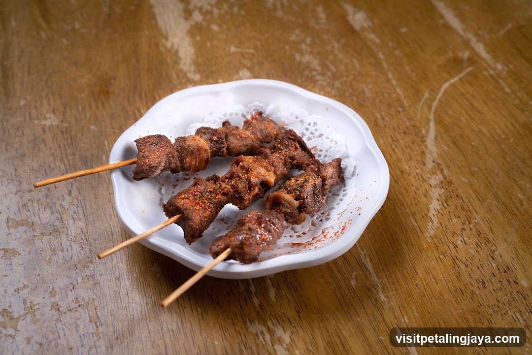 Spiced Meat Skewers on a White Plate