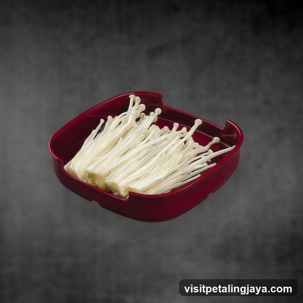 Enoki Mushrooms in Red Container