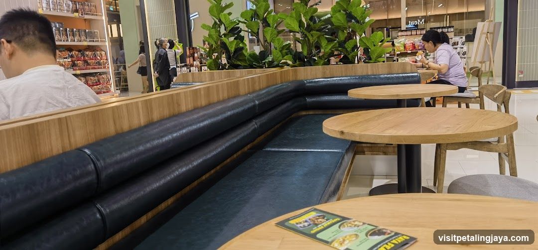 Interior seating area with tables and plants