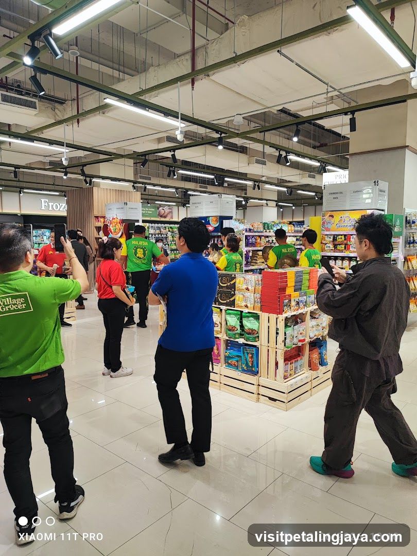Interior of a supermarket with staff and customers