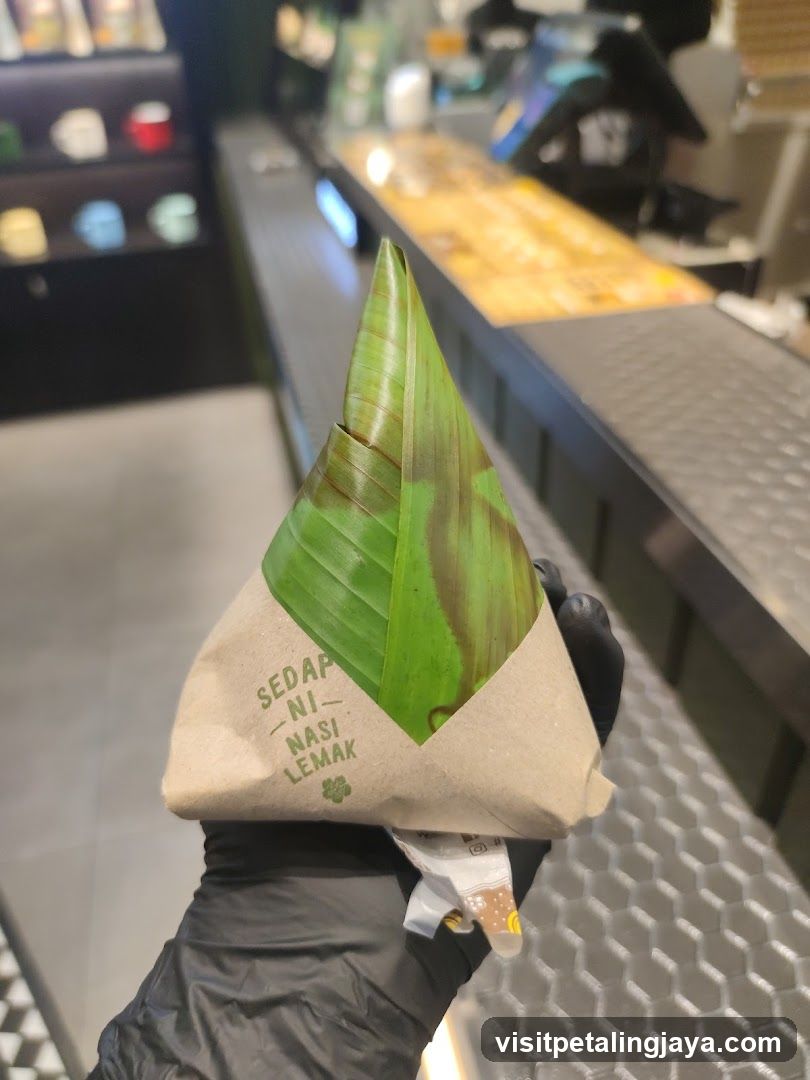 Hand holding a wrapped food item
