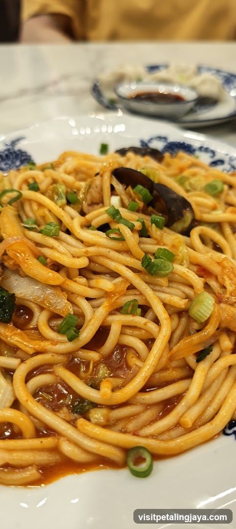 Noodle Dish with Sauce and Garnish
