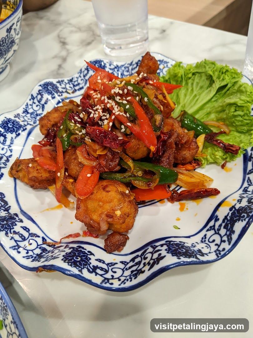 Stir-fried Chicken with Peppers and Sesame Seeds