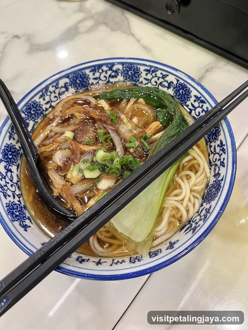 Bowl of Noodles with Broth and Vegetables