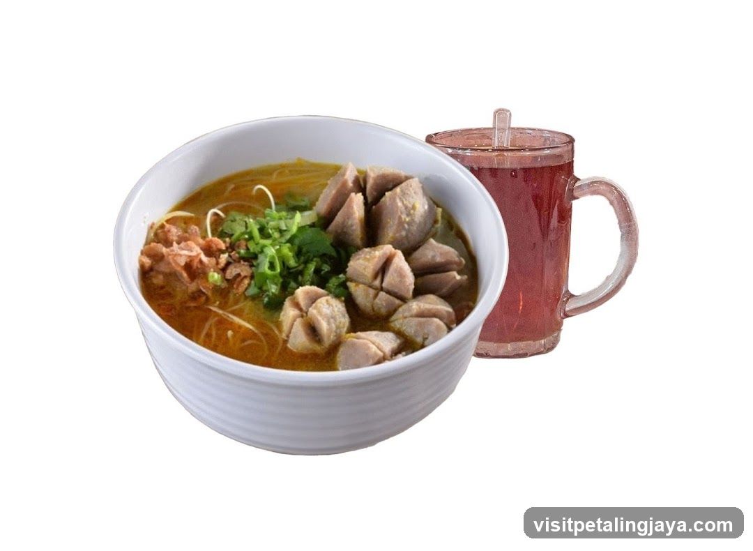 Bowl of Noodle Soup with Meatballs and Drink