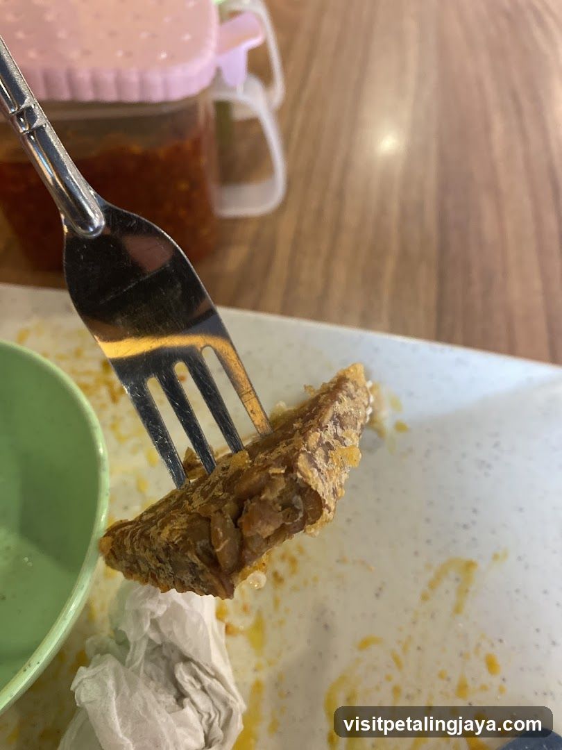 Fork Holding Fried Food