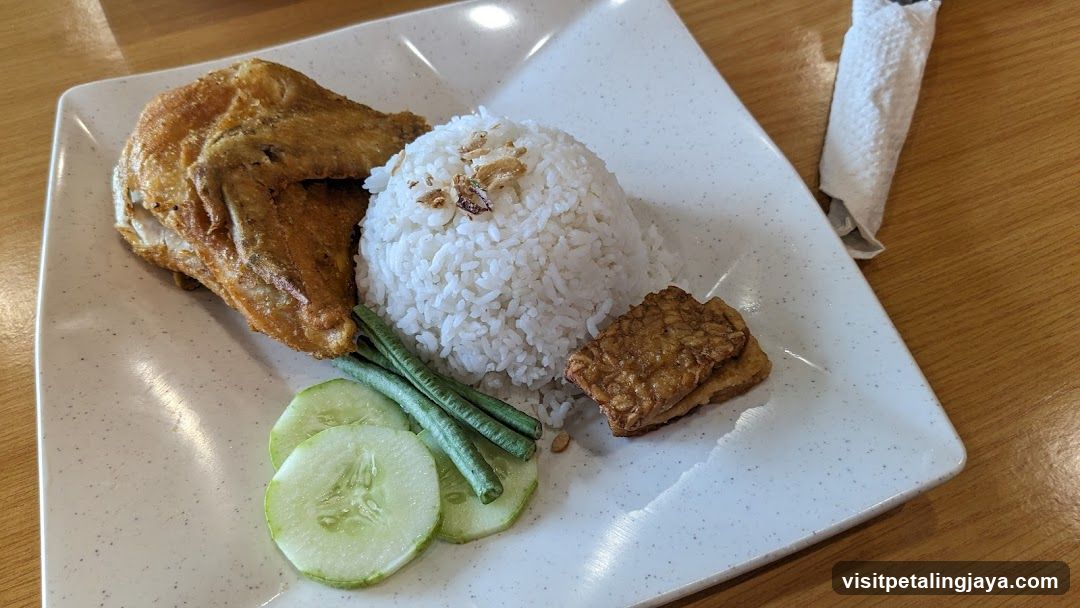 Plate of Fried Chicken with Rice and Vegetables