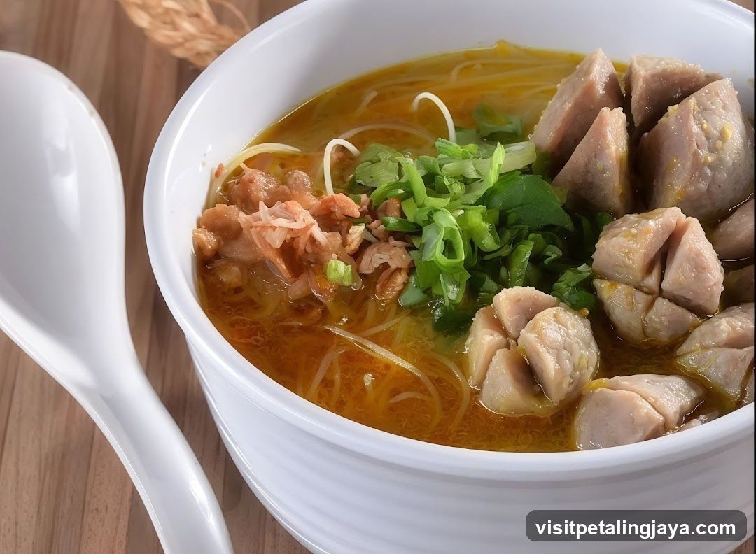 Bowl of Noodle Soup with Meat and Greens