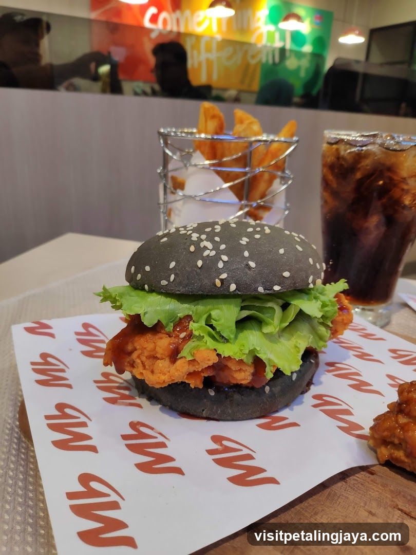 Black Burger with Fried Chicken and Fries