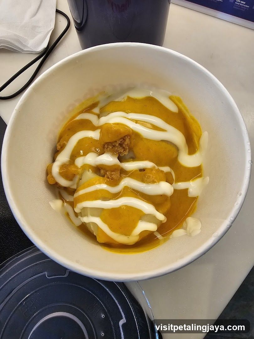Bowl of food with sauce and drizzle