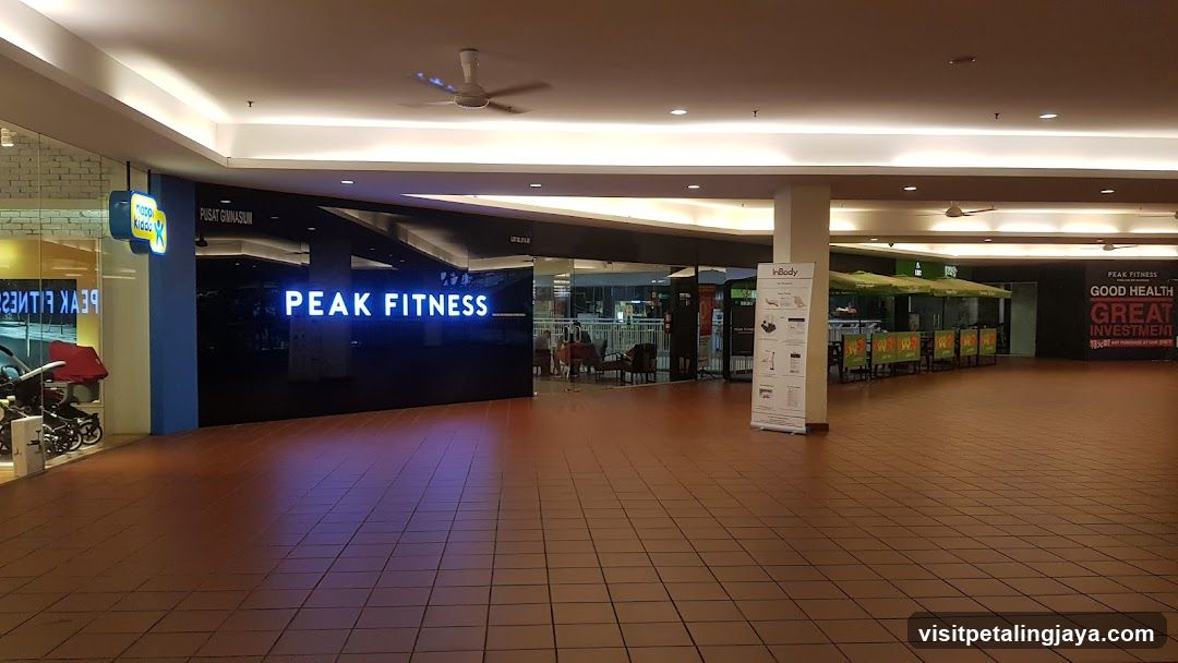 Shopping Mall Interior with Peak Fitness Signage