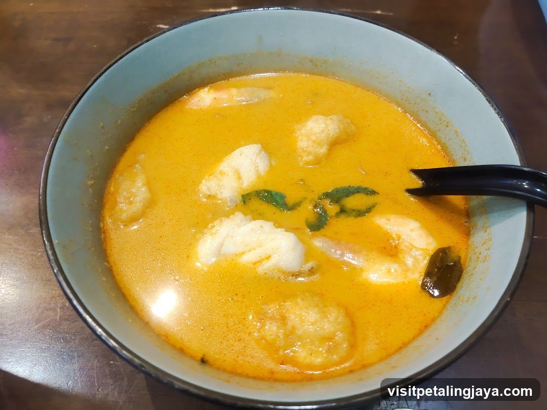 Bowl of Curry Soup with Shrimp and Fish Cake
