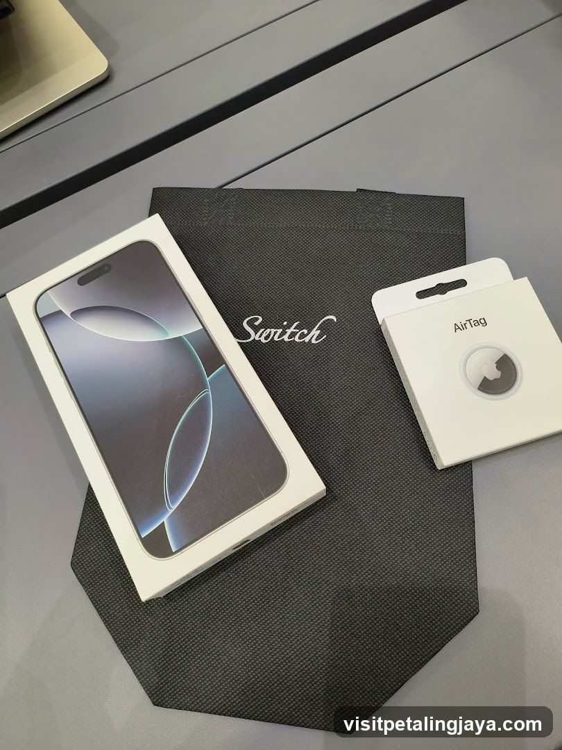 iPhone and AirTag packaging on a table