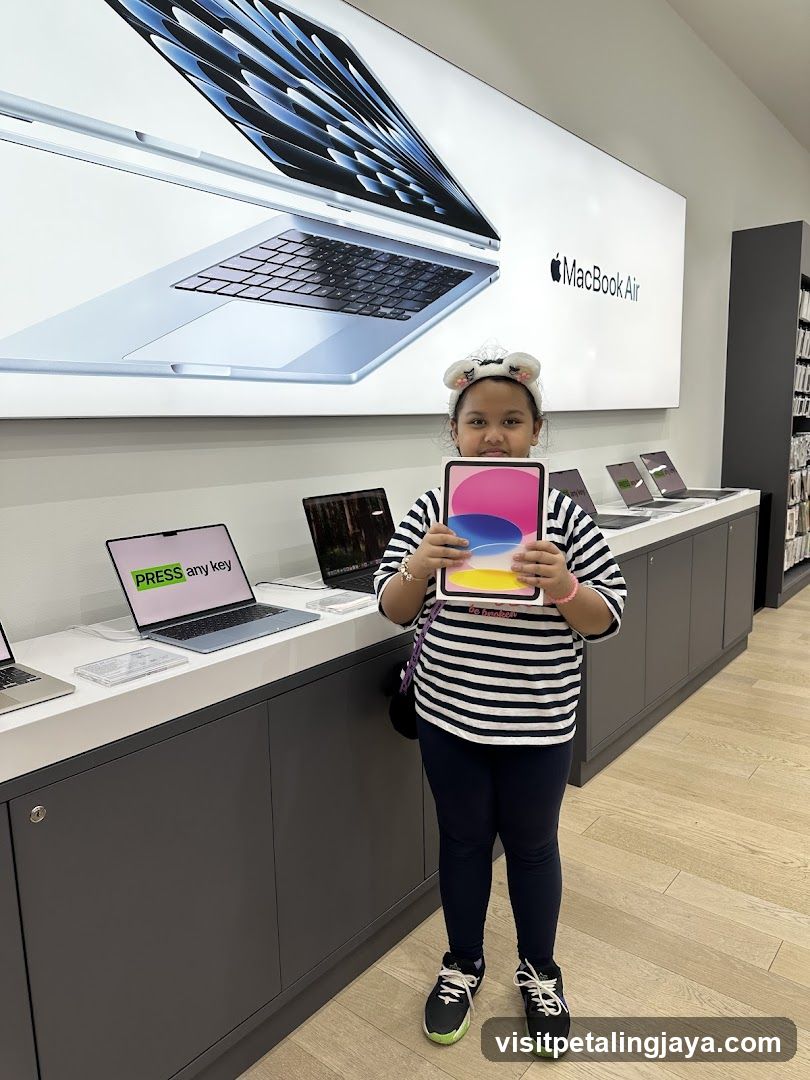 Child holding iPad in Apple Store