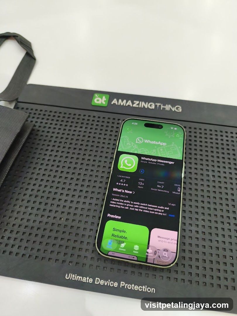 Smartphone Displaying WhatsApp App on Protective Mat