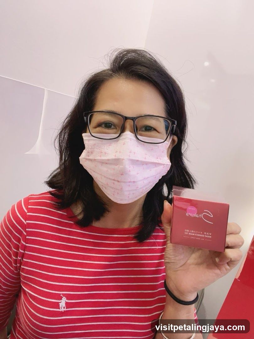 Woman holding a pink product box