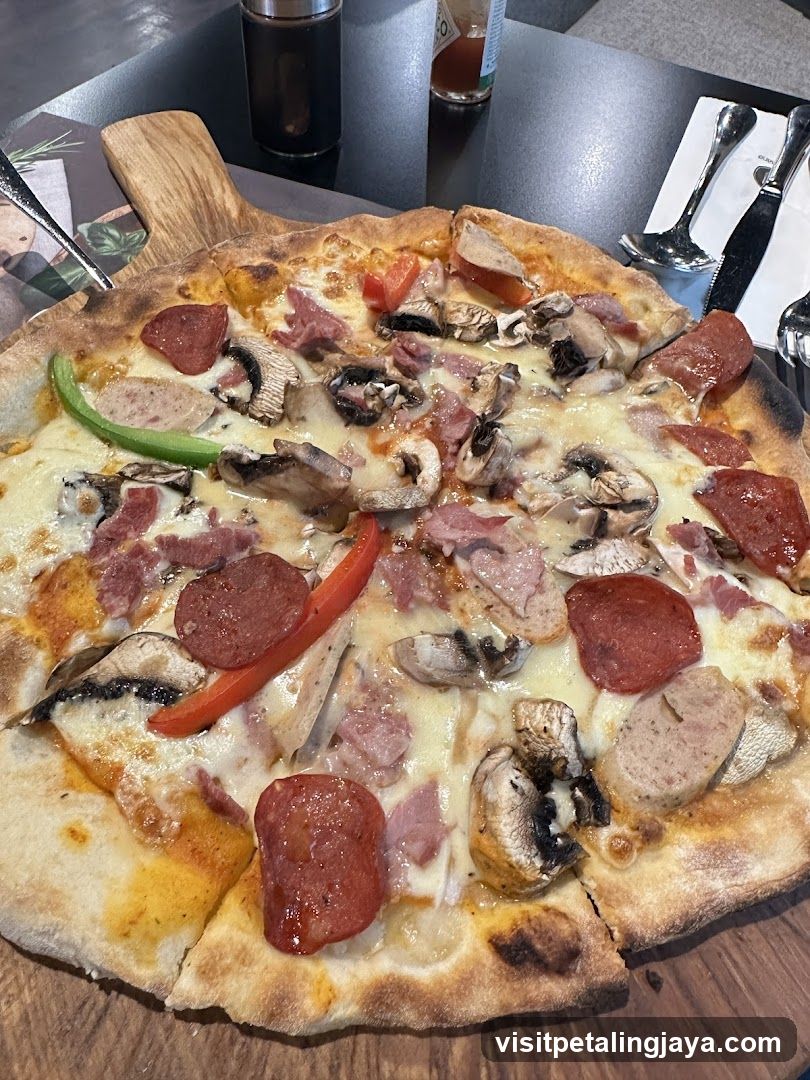 Pizza with toppings on a wooden board