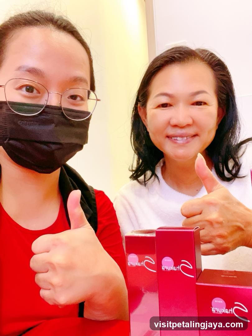 Two people giving thumbs up with products