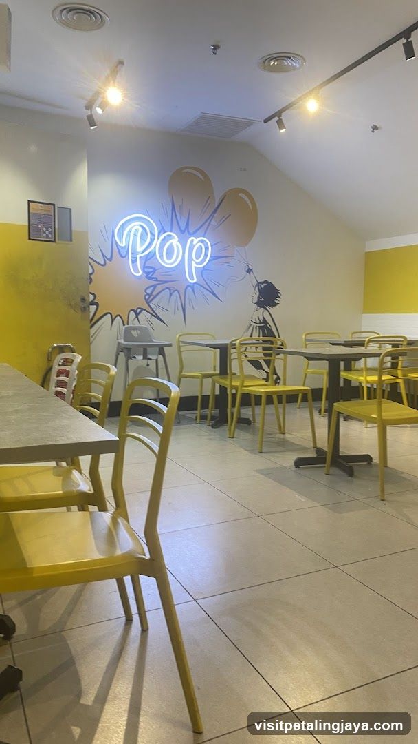 Interior of a casual dining space with neon art