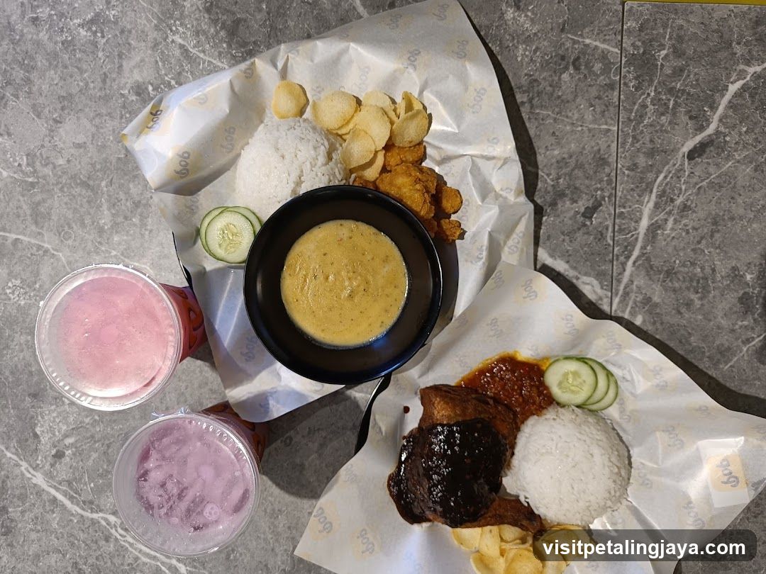 Food spread with rice, curry, and drinks