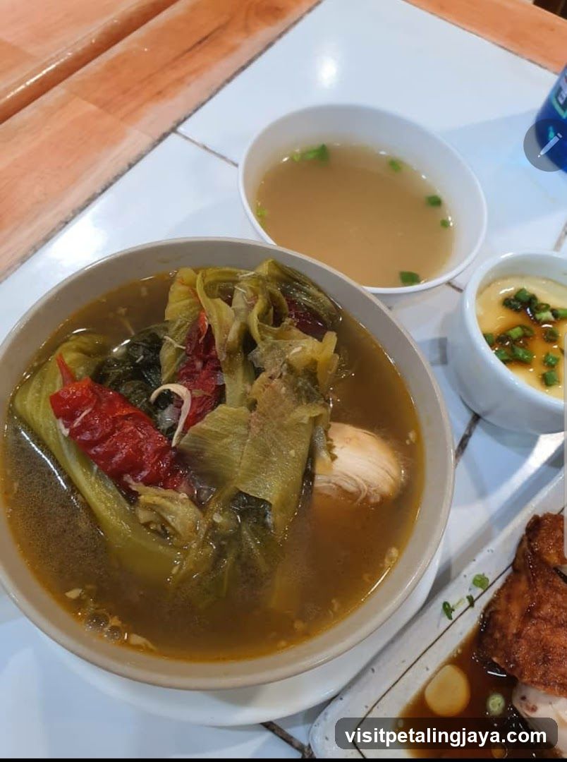 Bowl of Pickled Vegetables Soup with Side Dishes