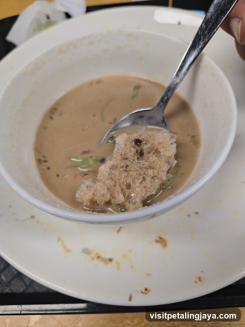 Bowl of Soup with Spoon