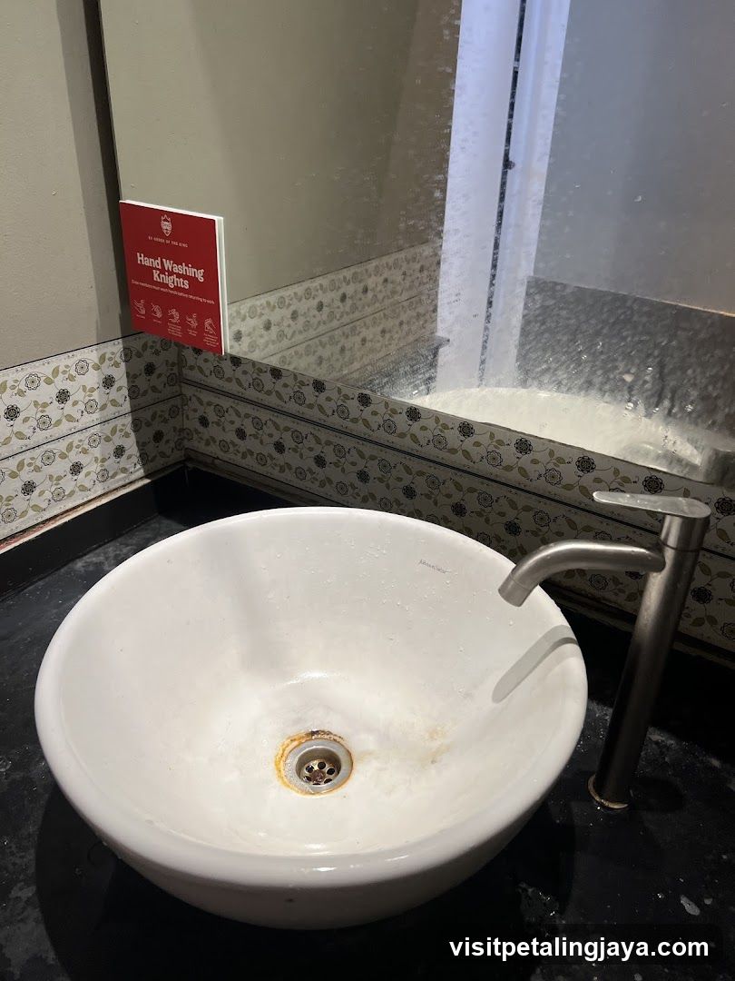 Bathroom Sink with Hand Washing Sign
