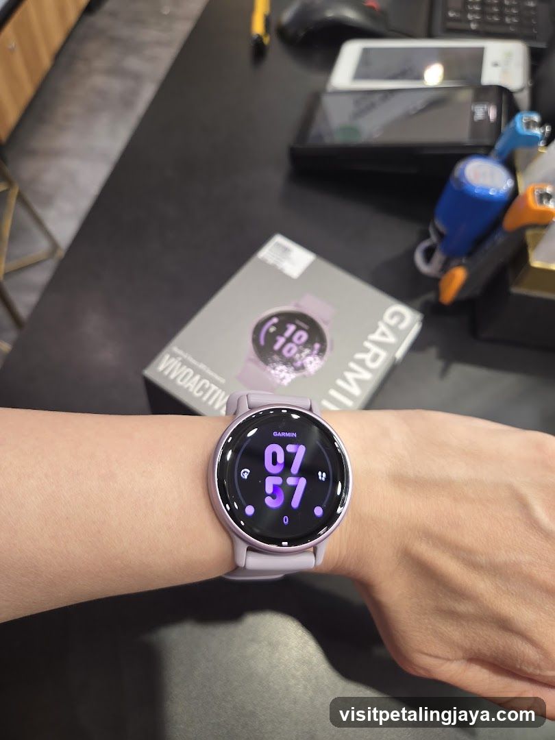 Garmin Watch on Wrist with Box in Background
