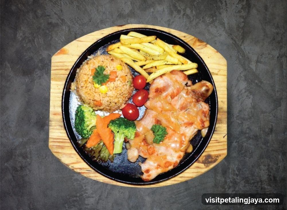 Sizzling Chicken Steak with Rice and Fries
