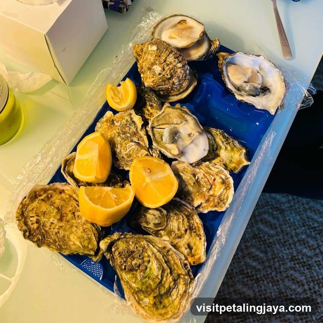 Oysters on a tray with lemon wedges