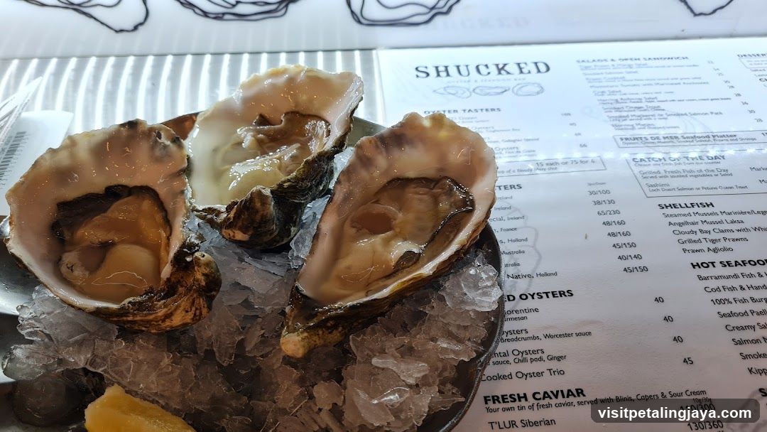 Oysters on Ice with Menu in Background