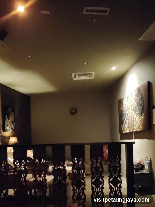 Interior of a dimly lit room with decorative railing