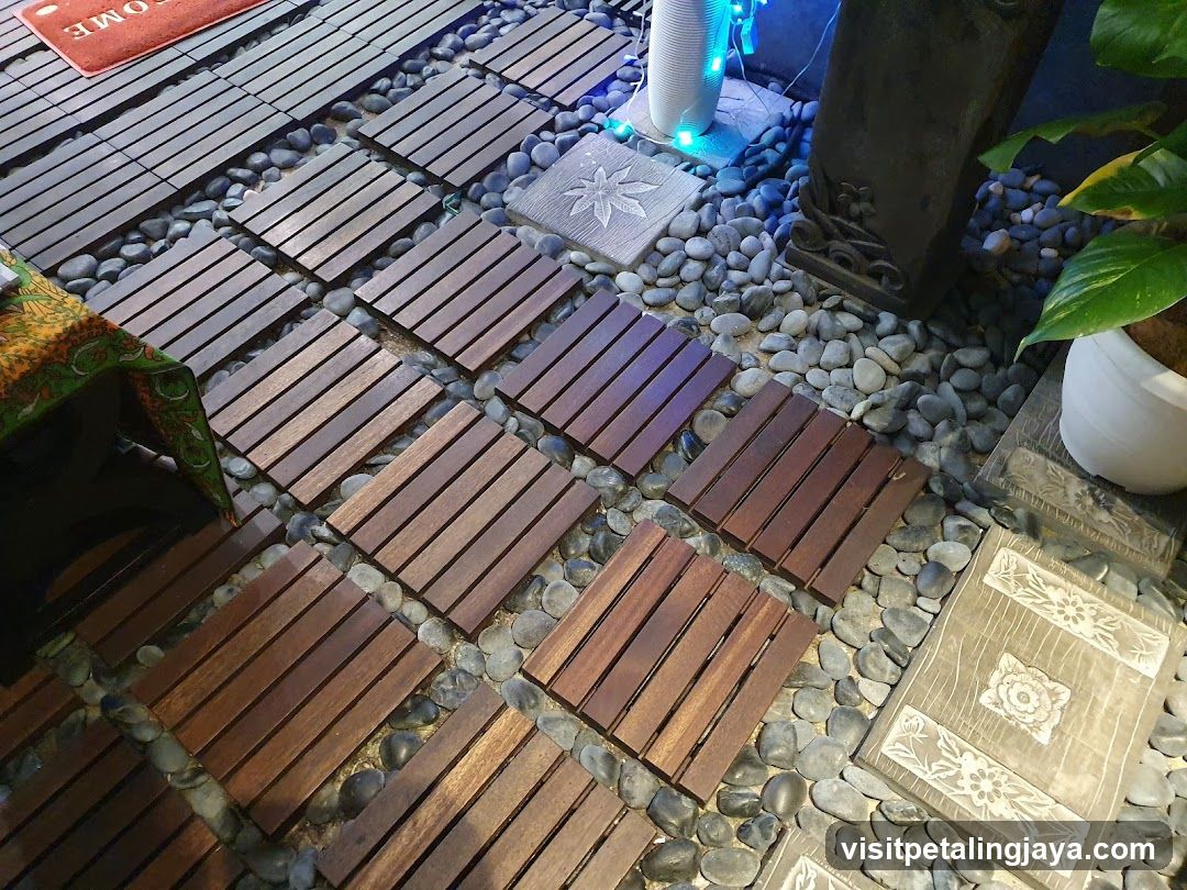 Outdoor Patio Area with Wooden Planks and Pebbles