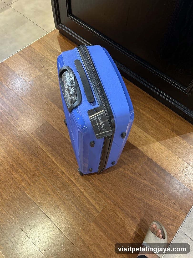 Blue Suitcase on Wooden Floor