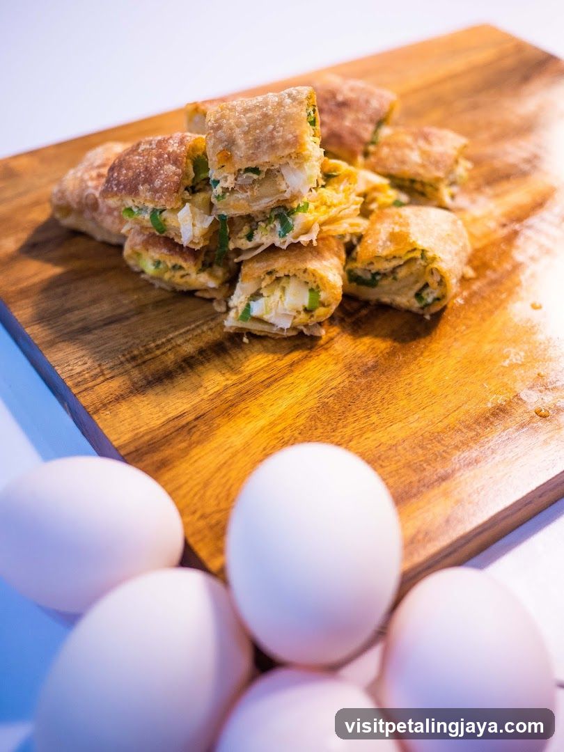 Egg Rolls on Wooden Board with Eggs