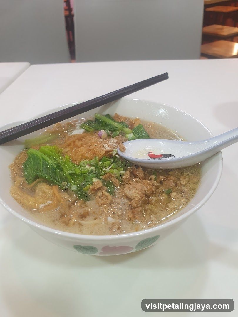 Bowl of Noodle Soup with Vegetables and Egg
