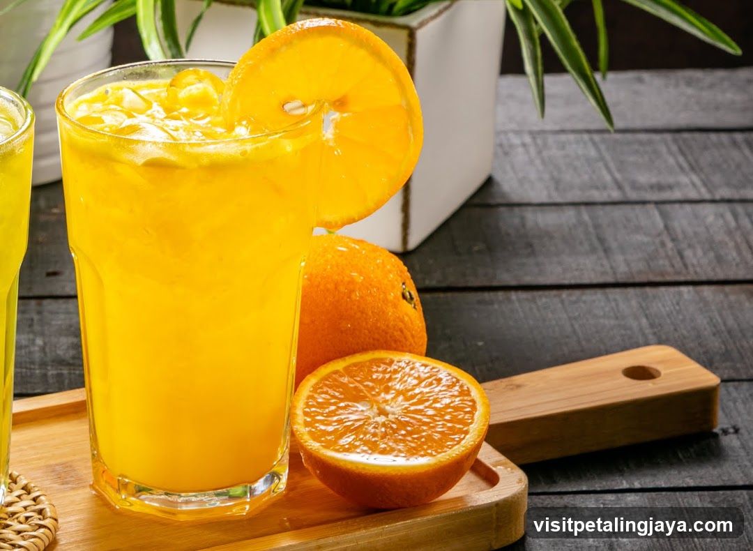 Fresh Orange Juice with Slices and Ice Cubes