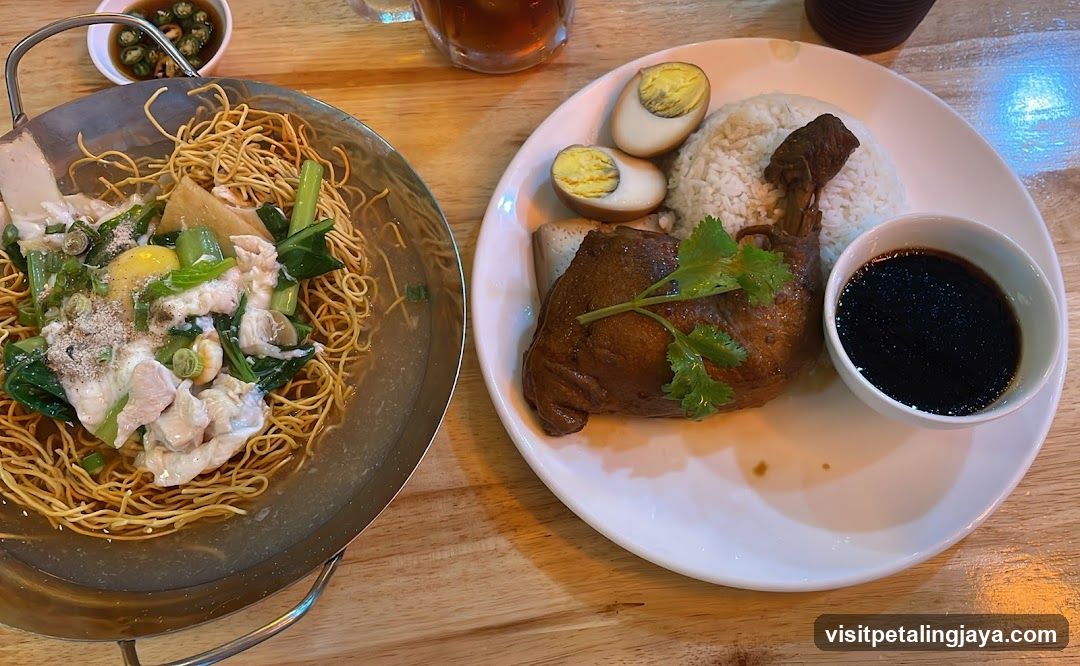 Dining Table with Noodles and Chicken Dish