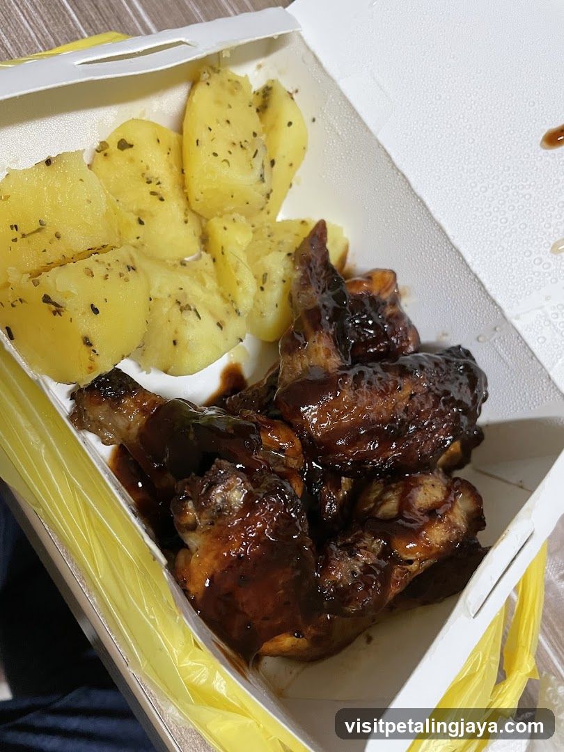 Takeout Meal with Wings and Potatoes
