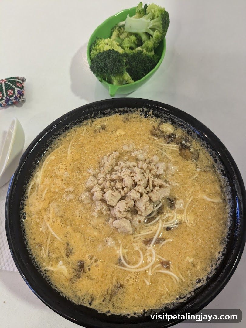 Bowl of Noodle Soup with Broccoli