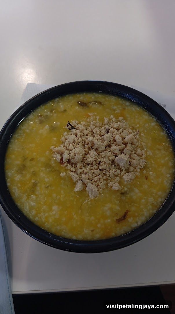 Bowl of congee with minced meat topping