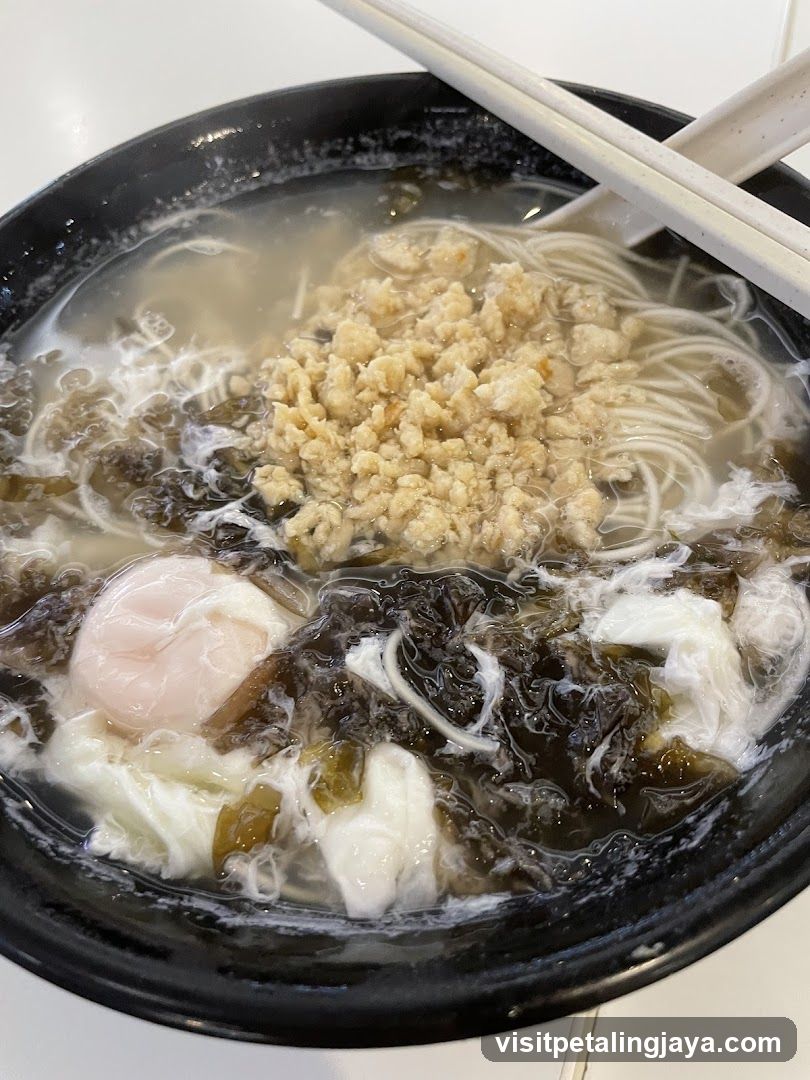 Bowl of Noodle Soup with Egg and Tofu