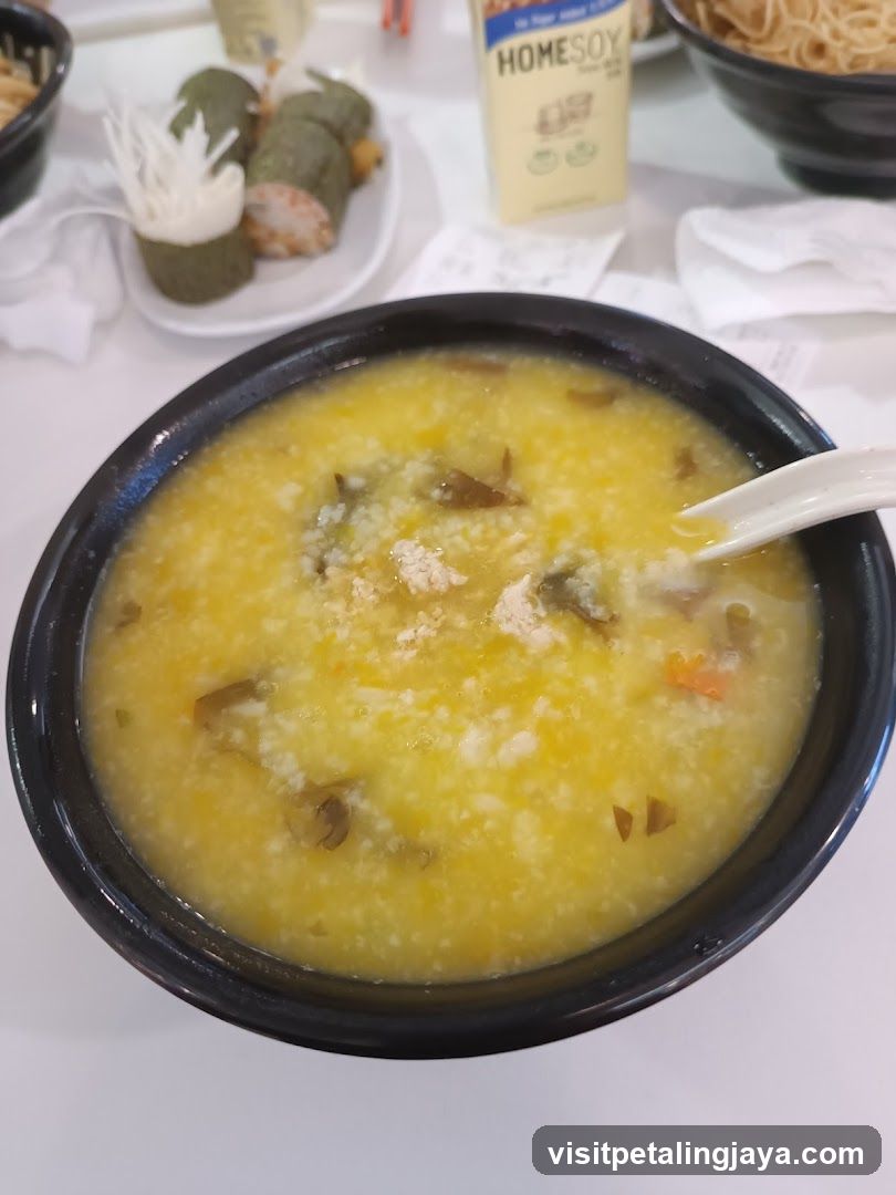 Bowl of congee with side dishes