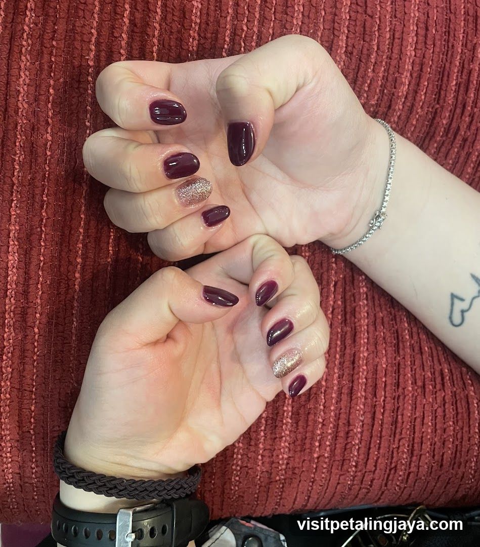 Maroon Nail Art with Glitter Accents