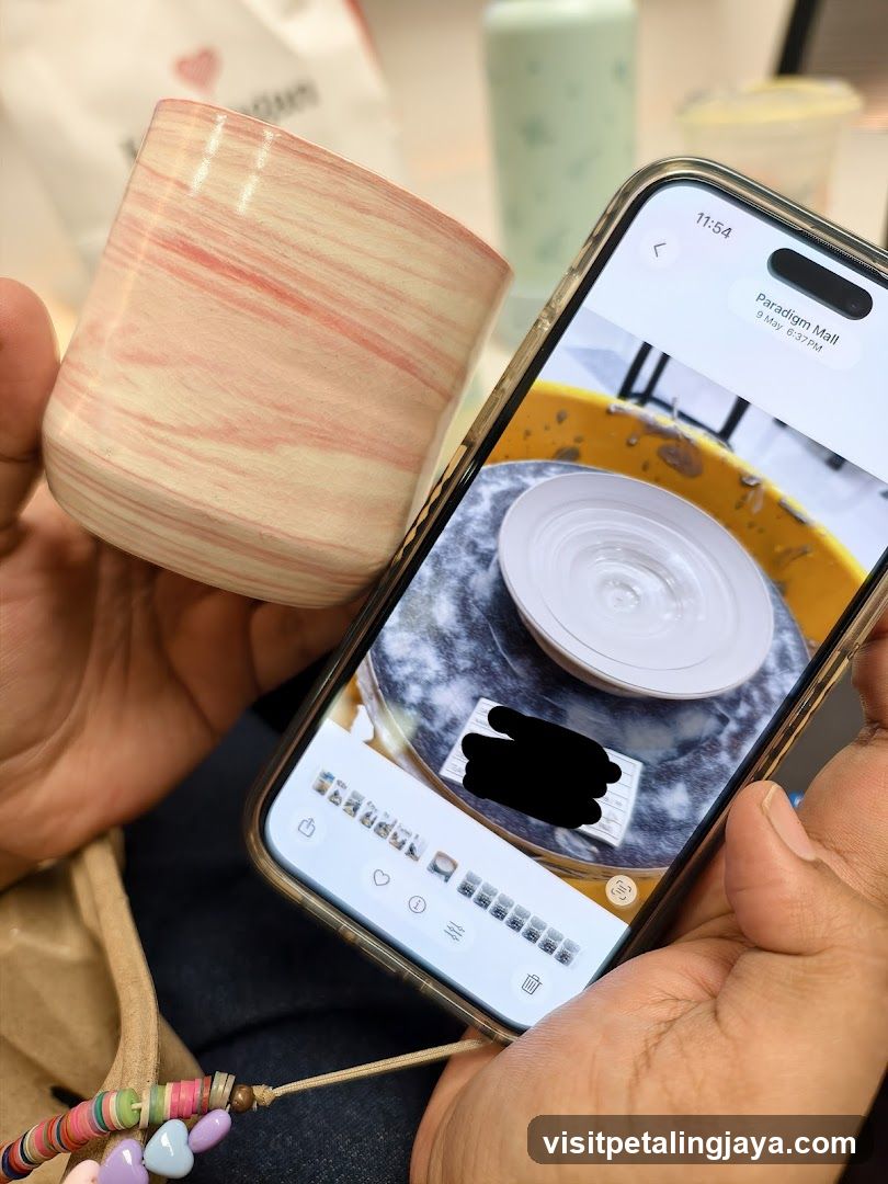 Handheld Ceramic Cup and Smartphone Display