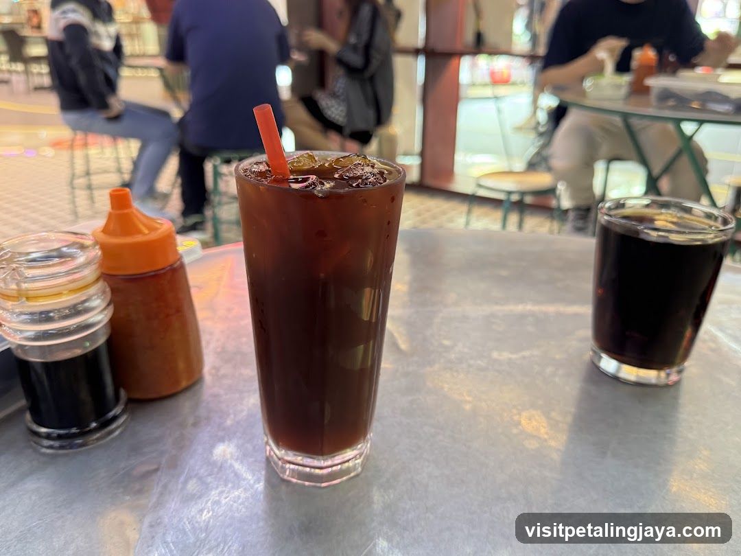 Iced Coffee and Condiments at a Cafe Table